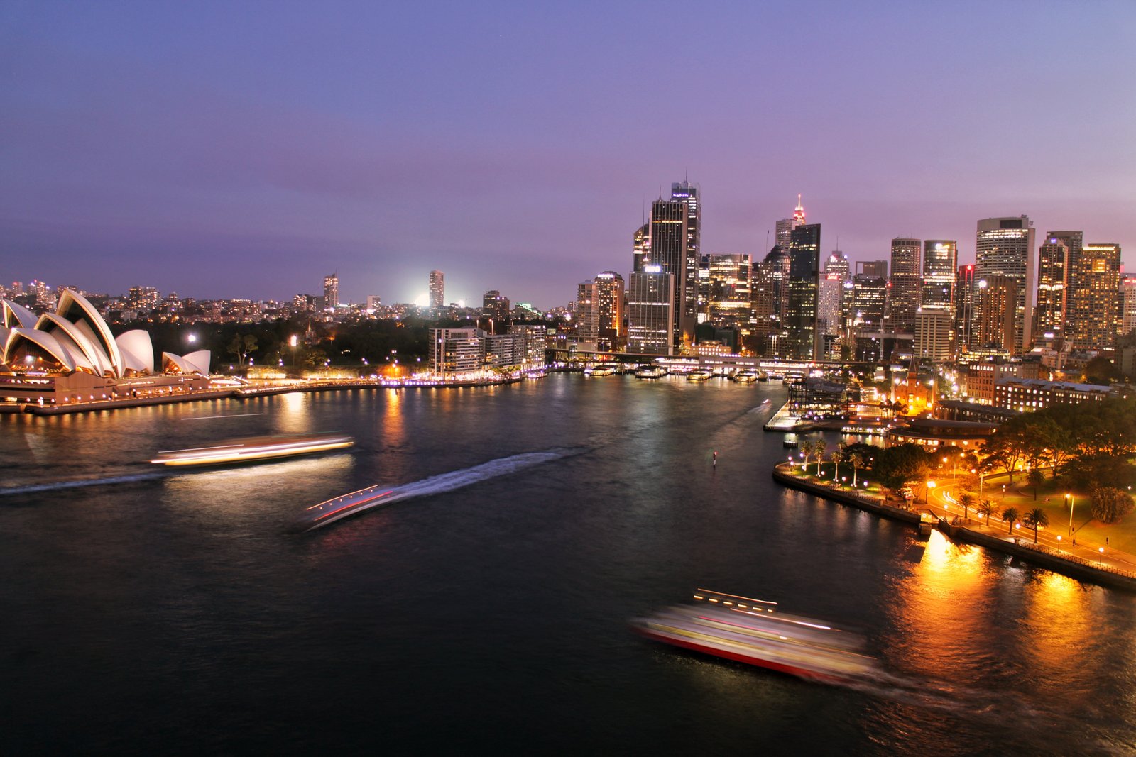 Sydney night skyline with visible opera house.