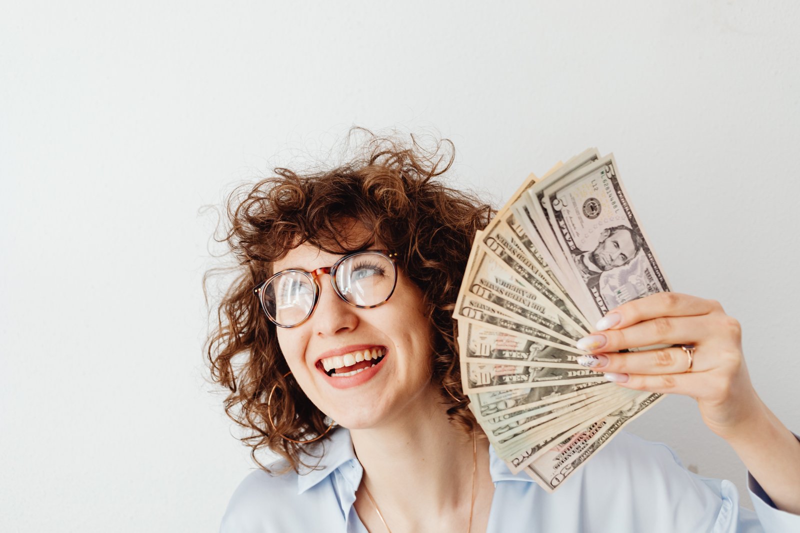 Happy Woman Holding US Dollars