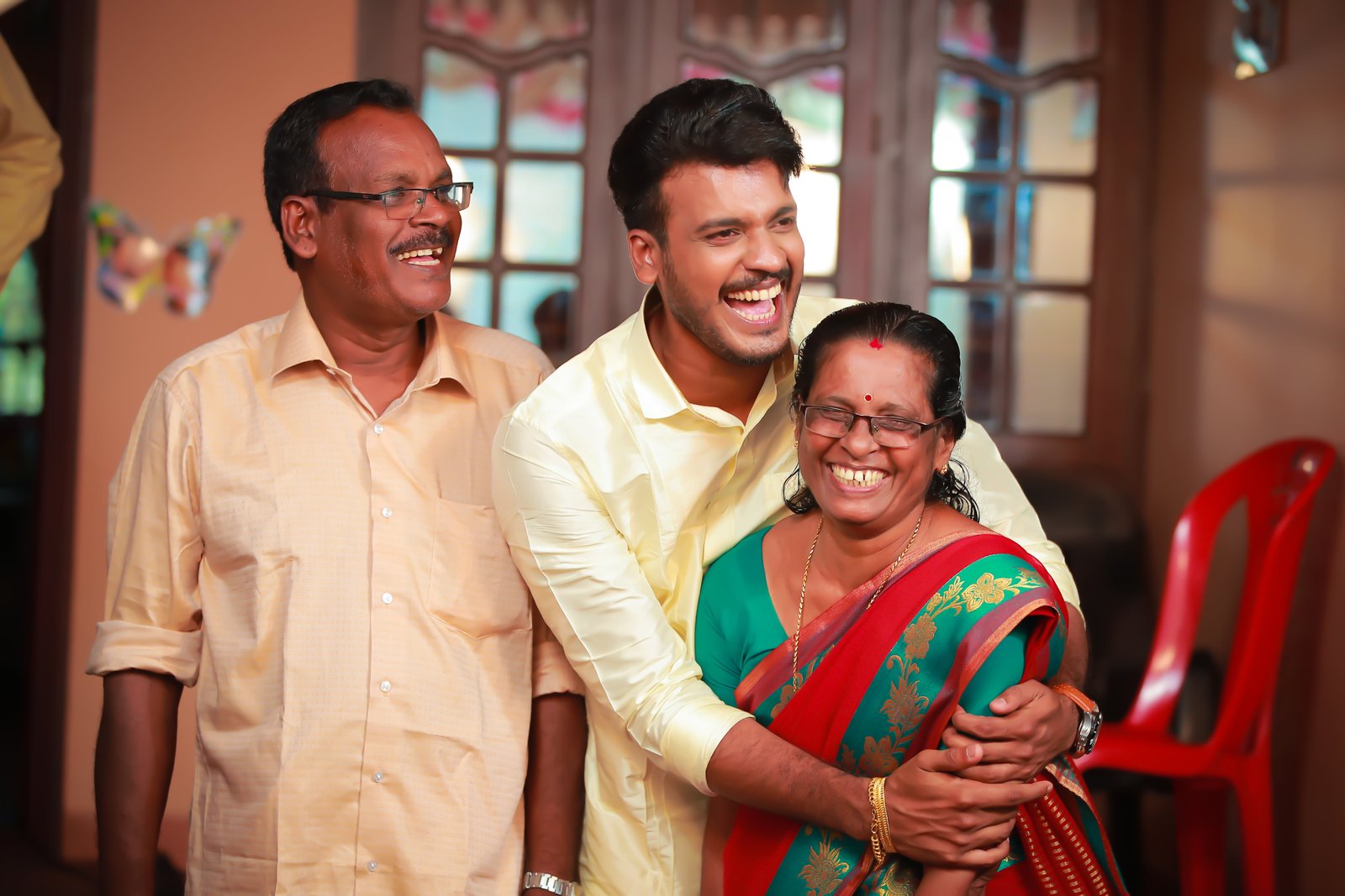 A beautiful happy moment between a father, mother and their son